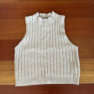 Sleeveless beige mock neck sweater top